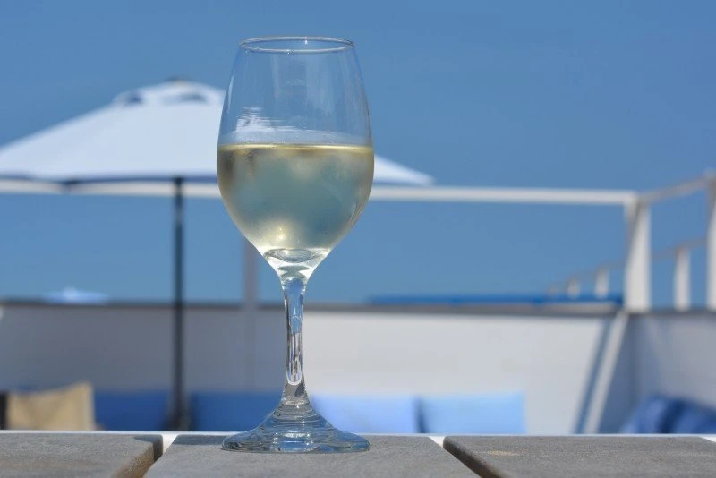 wine-glass-holiday-parasol-blue-sky-beach-bar